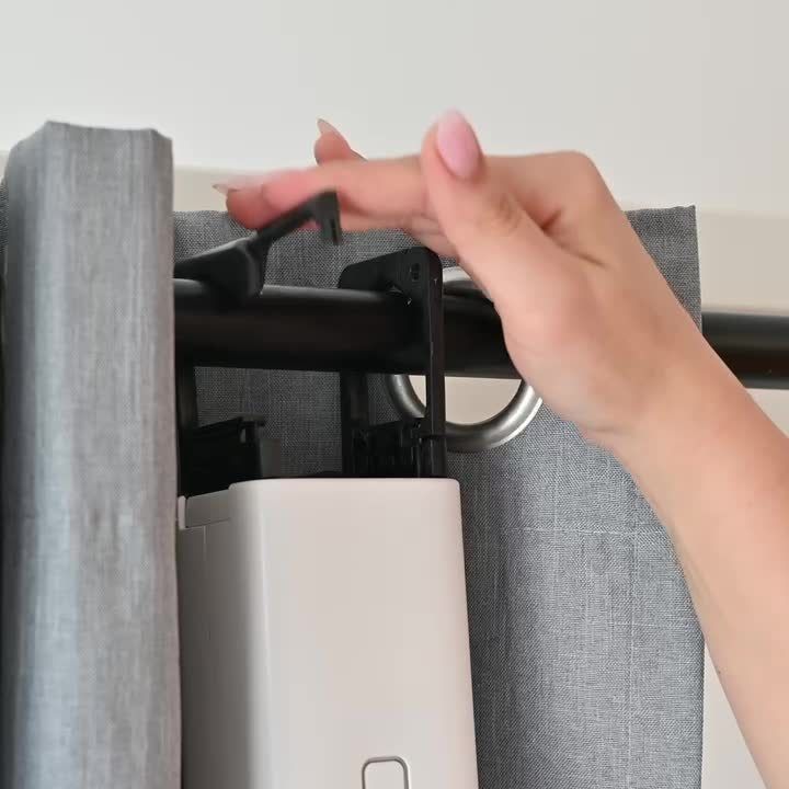 Hook the carabiners over the rod